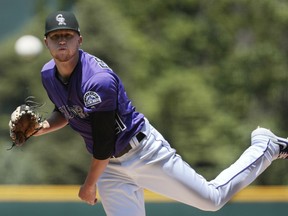 Colorado Rockies starting pitcher Kyle Freeland (21) throws in the first inning of a baseball game against the Arizona Diamondbacks in Denver, Thursday, May 30, 2019.