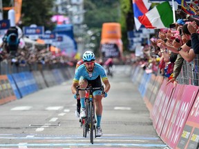 Italy's Dario Cataldo crosses the the finish line to win the 15th stage of the Giro d'Italia cycling race, from Ivrea to Como, Sunday, May 26, 2019.