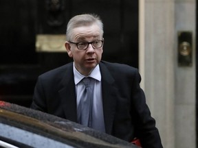 FILE - In this Thursday, Jan. 17, 2019 file photo Britain's Environment Secretary Michael Gove arrives at Downing Street. London.  Prime Minister Theresa May's announcement that she will leave 10 Downing Street has set off a fierce competition to succeed her as Conservative Party leader _ and as the next prime minister.