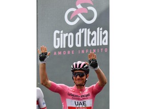 Overall leader Jan Polanc of Slovenia waves to supporters prior to the 14th stage of the Giro d'Italia cycling race, from Saint-Vincent to Courmayeur, Saturday, May 25, 2019.