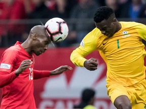 Canada's Atiba Hutchinson, left, gets his head on the ball in front of French Guiana's Soleymann Auguste during the second half of a CONCACAF Nations League qualifying soccer match in Vancouver, on Sunday March 24, 2019. The veteran Hutchinson and teenager Alphonso Davies highlight Canada's preliminary 40-man roster for this summer's Gold Cup.
