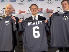 Eric Perez, the founder and CEO of the Toronto Wolfpack (left), Wolfpack head coach Paul Rowley and Toronto Mayor John Tory hold up jerseys of the new rugby league team in Toronto, Wednesday, April 27, 2016. The governing body of English rugby league has accepted a bid to put a franchise in Ottawa. Perez, who helped bring the sport to North America via the Wolfpack, is part of a Canadian consortium that acquired England's Hemel Stags team in the hope of moving it to Ottawa.THE CANADIAN PRESS/Neil Davidson