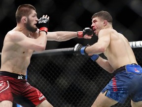 Russia's Khabib Nurmagomedov, left, punches Al Iaquinta during the third round of a lightweight title bout at UFC 223 early Sunday, April 8, 2018, in New York. (Raging) Al Iaquinta can knock you out or find you a new home. Ranked fourth among UFC lightweights, the 32-year-old from Wantagh, N.Y., works in real estate when not cage-fighting.