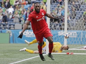 Toronto FC forward Jozy Altidore celebrates after he scored a goal against Seattle Sounders goalkeeper Stefan Frei, right, during the first half of an MLS soccer match in Seattle on April 13, 2019. Toronto FC may be muddling through a slump, but that doesn't mean the Vancouver Whitecaps are underestimating their Canadian competition this week. TFC (5-6-2) suffered a disappointing 2-1 loss to the San Jose Earthquakes last week, extending a winless streak to five games.