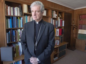 Archbishop Christian Lepine is seen in his office Wednesday, March 27, 2019 in Montreal. Montreal's Archbishop says he fears the province's move to legislate on secularism will come at the expense of individual freedoms.