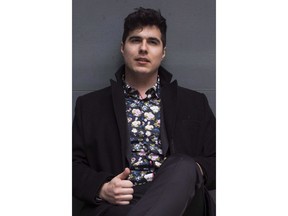 Jeremy Dutcher poses in Toronto on April 10, 2018. Acclaimed Indigenous singer Dutcher is embarking on a fall tour paired with local orchestras from across the country.