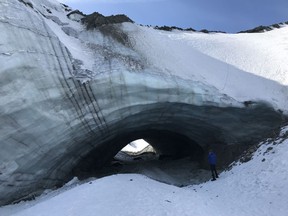 The Kluane ice cave near Haines Junction, Yukon is seen in this undated handout photo. A unique, cave-like tunnel formed by a retreating glacier in Yukon, has collapsed, months after hikers were warned to stay clear of the increasingly unstable formation. The Kluane ice cave, about 170 kilometres west of Whitehorse, has been a popular hiking destination for years but a geologist with the Yukon Geological Survey says a new photo confirms the tunnel is gone.