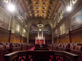 The Senate chamber sits empty on September 12, 2014 in Ottawa. The Federal Court of Appeal says the government does not have to release parts of a 2013 confidential memo for Stephen Harper written by the country's top bureaucrat because it constitutes legal advice.