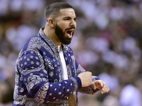 Aubrey "Drake" Graham reacts from courtside during second half NBA Eastern Conference playoff action between the Toronto Raptors and the Philadelphia 76ers, in Toronto on Saturday, April 27, 2019.