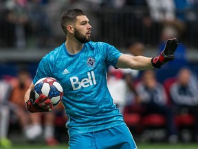 Vancouver Whitecaps' goalkeeper Maxime Crepeau (16) plays the ball during second half MLS soccer action against the Minnesota United, in Vancouver on Saturday, March 2, 2019. Vancouver Whitecaps goalkeeper Maxime Crepeau doesn't want to be labelled a leader. Instead, he wants his teammates to see him as "a brother on the field" who'll fight for them and have their backs.