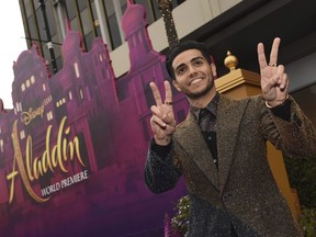 Mena Massoud arrives at the premiere of "Aladdin" on Tuesday, May 21, 2019, at the El Capitan Theatre in Los Angeles. Canadian "Aladdin" star Mena Massoud says his wild carpet ride to movie stardom has been bewildering, and humbling.