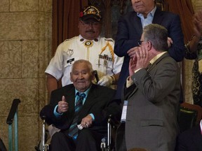 Louis Levi Oakes, from Akwesasne, Que. gives the thumbs up as he receives a standing ovation after being recognized by the Speaker of the House of Commons following question period in Ottawa on December 4, 2018. A funeral will be held Saturday for the last of the Mohawk code talkers from the Second World War, Louis Levi Oakes, who died peacefully on Tuesday surrounded by family at age 94. Oakes was the last surviving member of a group that used the Mohawk language to help relay encrypted secure messages to Allied forces during the Second World War - one of 33 native languages used by U.S. troops to share vital information.