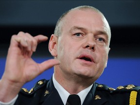 Dale McFee, President of the Canadian Association of Chiefs of Police, answers a question during an announcement in Ottawa on December 5, 2011. Edmonton's police chief has issued a formal apology for wrongdoing committed by the police department against members of the city's LGBTQ community. Chief Dale McFee says the apology acknowledges that while the Edmonton Police Service has an obligation to uphold the law, it has not always demonstrated behaviour that embodies the department's core values.