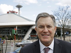 In this March 16, 2017 photo, Tim Leiweke, head of the Oak View Group, poses for a photo in front of KeyArena in Seattle. Leiweke is loving what he sees. And the former MLSE boss will get a firsthand look Sunday when he takes in the Raptors and Game 2 of the NBA Finals.