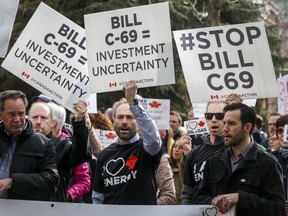 Pro-pipeline supporters rally outside a public hearing of the Senate Committee on Energy, the Environment and Natural Resources regarding Bill C-69 in Calgary, Alta., Tuesday, April 9, 2019. Environment advocates say Canadian senators are bowing to pressure from the energy industry to gut the government's environmental assessment legislation.