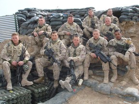 Lionel Desmond (front row, far right) was part of the 2nd battalion, of the Royal Canadian Regiment, based at CFB Gagetown and shown in this 2007 handout photo taken in Panjwai district in between patrol base Wilson and Masum Ghar in Afghanistan. Nova Scotia's Justice Department is trying to muzzle an inquiry investigating the death of an Afghan war veteran who killed his family and himself more than two years ago, a senior lawyer says.