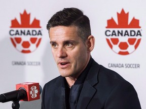 Canada men's national soccer team newly-announced coach John Herdman speaks at a press conference at BMO Field in Toronto on February 26, 2018. Canada cut its Gold Cup roster to 23 Thursday, with uncapped Noble Okello and Kamal Miller joining veterans Atiba Hutchinson, Jonathan Osorio, Russell Teibert, Samuel Piette and Milan Borjan. Coach John Herdman had named a preliminary 40-man roster earlier in May. Only injury-related changes will be allowed from now on from that list, up until 24 hours before a team's first match.