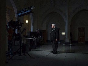 Senator Murray Sinclair takes part in a television interview in the foyer of the House of Commons on April 12, 2016 in Ottawa. Former Truth and Reconciliation Commission chairman Murray Sinclair says a video featuring a Mountie interrogating a young Indigenous woman disclosing sexual abuse in B.C. foster care brings home in a "visceral way" a reality that Canadians should be shocked by and one that they need to see. The video was released publicly by APTN this week as a result of a court proceeding and has prompted political reaction including from the federal public safety minister, who called its contents "absolutely abhorrent."