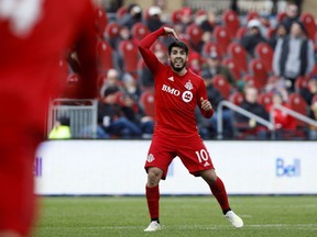 Toronto FC midfielder Alejandro Pozuelo (10) calls for a header from midfielder Michael Bradley (4) during second half MLS soccer action against the Portland Timbers at BMO field in Toronto, Saturday, April 27, 2019. After surviving the heat of Orlando, Toronto FC faces a new challenge in Atlanta United. The defending MLS champions are beginning to find their form after a rocky start under new coach Frank de Boer.THE CANADIAN PRESS/Cole Burston