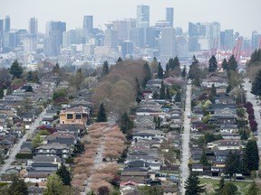 A real estate market outlook by Vancouver's Central 1 Credit Union says tougher federal and provincial government housing policies are behind a drop in demand for resale housing in British Columbia. Homes are pictured in Vancouver, Tuesday, Apr. 16, 2019.