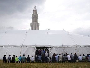 Worshippers take part in afternoon prayers on the last Friday of Ramadan at the Baitul Islam Mosque in Vaughan, Ont., prior to Canada Day festivities on Friday, July 1, 2016. A Canadian psychiatrist is taking the lead on advising doctors to help address the needs of mentally ill Muslim patients whose medication regimen could be affected by fasting during the upcoming religious observance of Ramadan.