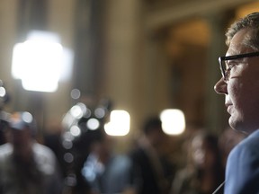 Premier Scott Moe speaks to media in the rotunda during Budget Day at Legislative Building in Regina, Saskatchewan on Wednesday March 20, 2019. Saskatchewan's Court of Appeal will release its decision on the constitutionality of a federally imposed carbon tax this week.