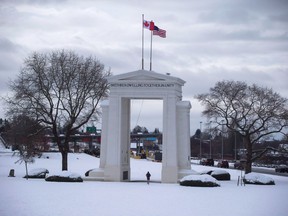 A man jogs under the Peace Arch at the border crossing between Canada and the United States, in Surrey, B.C., on Sunday February 5, 2017. A man who was killed in a fiery crash near the Peace Arch border crossing in British Columbia last week was a pastor and father of three from Richmond.