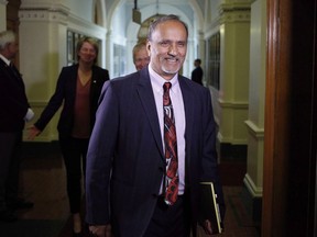 FILE-- Surrey-Newton NDP MLA Harry Bains arrives to the start of the debate at B.C. Legislature in Victoria on June 26, 2017. he momentum has shifted towards the labour movement in British Columbia with changes announced in provincial labour laws Tuesday.