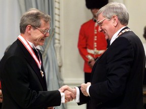 Thomas Courchene is congratulated by Governor General Romeo LeBlanc after being invested into the Order of Canada in Ottawa Wednesday April 14, 1999. Courchene has won the $50,000 Donner Prize for best Canadian public policy book for a second time.