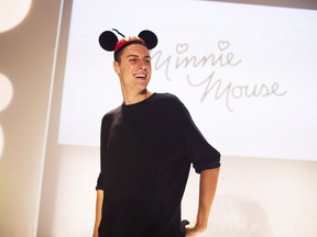 Finalist Sid Neigum is crowned with mouse ears after winning the Mercedez-Benz Start Up program where finalists created designs inspired by Minnie Mouse at World MasterCard Fashion Week in Toronto on Tuesday, October 21, 2014. Neigum has won big at the Canadian Arts and Fashion Awards. The Alberta-born, Toronto-based designer was crowned womenswear designer of the year and won a $20,000 grant at an annual bash in Toronto.THE CANADIAN PRESS/Michelle Siu