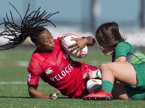 FILE -- Canada's Charity Williams (left) is tackled by Ireland's Amee Leigh Murphy Crowe during the World Rugby Women's Sevens Series in Langford, B.C., Saturday, May, 12, 2018. Canada's bid for a women's rugby sevens berth in the 2020 Tokyo Olympics came closer to reality Saturday with wins over Brazil and Ireland on home soil at Westhills Stadium.