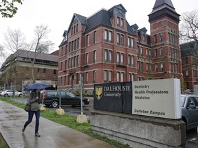 A pedestrian walks by the Dalhousie Dentistry Building in Halifax on Friday, May 22, 2015.At a time when Canada is attracting more students from around the world, there are concerns qualified applicants from certain countries are getting turned away because of its visa process.