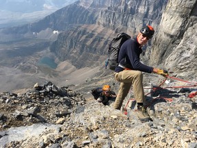 Yamnuska Mountain Adventures guide Richard Howes ropes up Rosanne Drescher on the most technical part of Mount Temple's ascent on Sept. 7, 2018. Most of the hike can be done on two legs, but guides know the safest route to the top of the 3,543-metre peak in Banff National Park near Lake Louise, Alta.