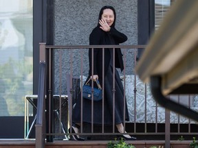 Huawei chief financial officer Meng Wanzhou waves as she returns home after attending a court appearance in Vancouver on Wednesday May 8, 2019. The defence team for Huawei executive Meng Wanzhou says it plans to argue that she shouldn't be extradited to the United States because she hasn't violated sanctions under Canadian laws and her arrest at Vancouver's airport was unlawful.