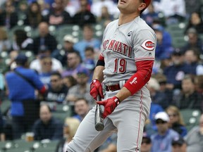 Cincinnati Reds' Joey Votto reacts after striking out swinging during the first inning of a baseball game against the Chicago Cubs, Friday, May 24, 2019, in Chicago.