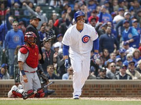 Chicago Cubs' Anthony Rizzo watches his three-run home run off of St. Louis Cardinals starting pitcher Jack Flaherty during the third inning of a baseball game, Friday, May 3, 2019, in Chicago.