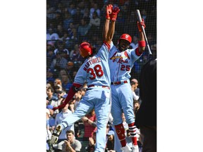 St. Louis Cardinals' Jose Martinez (38) high-fives Dexter Fowler (25) after Martinez hit a home run during the second inning of a baseball game against the Chicago Cubs, Saturday, May 4, 2019, in Chicago.