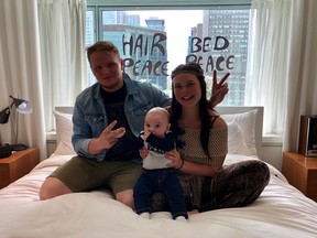 Beatles fans Riley Howarth, Amy Love Samson and their four-month-old son Mason Wild enjoy the Fairmount Queen Elizabeth Hotel suite, where John Lennon and Yoko Ono hosted their first North American bed-in and recorded "Give Peace A Chance" 50 years ago, in Montreal on Saturday, May 25, 2019. It was 50 years ago today, John and Yoko told the band to play. The week-long bed-in that saw a pajama-clad John Lennon and Yoko Ono host a parade of journalists, actors, gurus, advocates and hangers-on in their Montreal hotel suite kicked off on May 25, 2019, culminating in the on-site recording of "Give Peace A Chance."