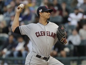 Cleveland Indians starting pitcher Carlos Carrasco throws to a Chicago White Sox batter during the first inning of a baseball game in Chicago, Thursday, May 30, 2019.