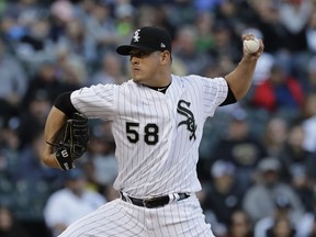 Chicago White Sox starting pitcher Manny Banuelos throws against the Boston Red Sox during the first inning of a baseball game in Chicago, Saturday, May 4, 2019.