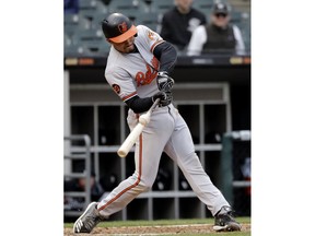 Baltimore Orioles' Richie Martin hits a triple against the Chicago White Sox during the eighth inning of the first game of a baseball doubleheader in Chicago, Wednesday, May 1, 2019.