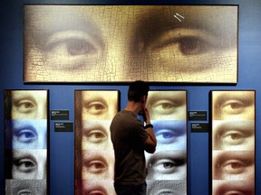 Derek Andrews looks over artwork at the Da Vinci  The Genius exhibition at the Telus World of Science in Edmonton.