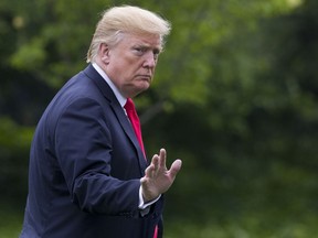 President Donald Trump waves after stepping off Marine One on the South Lawn of the White House, Friday, May 17, 2019, in Washington. Trump is returning from a trip to New York.