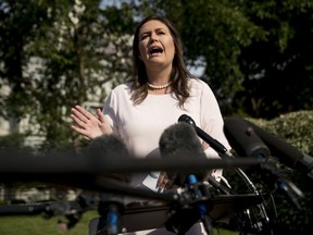 White House press secretary Sarah Huckabee Sanders speaks to reporters on the North Lawn outside the West Wing at the White House in Washington, Thursday, May 23, 2019.