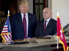 President Donald Trump welcomes Switzerland's Federal President Ueli Maurer, right, to the White House, Thursday, May 16, 2019, in Washington.