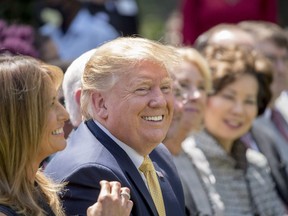 President Donald Trump and First lady Melania Trump, left, smile during a one year anniversary event for her Be Best initiative in the Rose Garden of the White House, Tuesday, May 7, 2019, in Washington.
