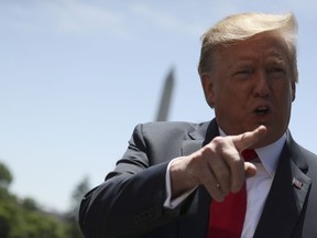 President Donald Trump speaks to members of the media on the South Lawn of the White House in Washington, Friday, May 24, 2019, before boarding Marine One for a short trip to Andrews Air Force Base, Md, and then on to Tokyo.