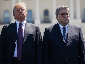 President Donald Trump stands with Attorney General William Barr during the 38th Annual National Peace Officers' Memorial Service at the U.S. Capitol, Wednesday, May 15, 2019, in Washington.