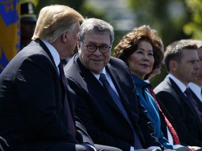 President Donald Trump talks with Attorney General William Barr during the 38th Annual National Peace Officers' Memorial Service at the U.S. Capitol, Wednesday, May 15, 2019, in Washington.