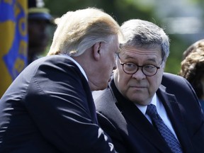 President Donald Trump and Attorney General William Barr attend the 38th Annual National Peace Officers' Memorial Service at the U.S. Capitol, Wednesday, May 15, 2019, in Washington.